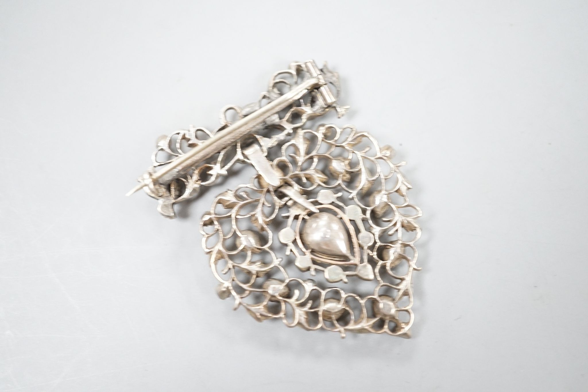 A 19th century white metal and rose cut diamond set heart shaped drop pendant brooch, 50mm.